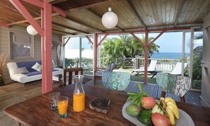 Outdoor dining - Creole wood house, stunning ocean view, pool, 2BR AC - Les Palmiers Rouges (Le François)