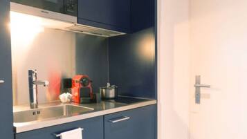 Fridge, microwave, cookware/dishes/utensils