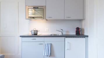Fridge, microwave, cookware/dishes/utensils