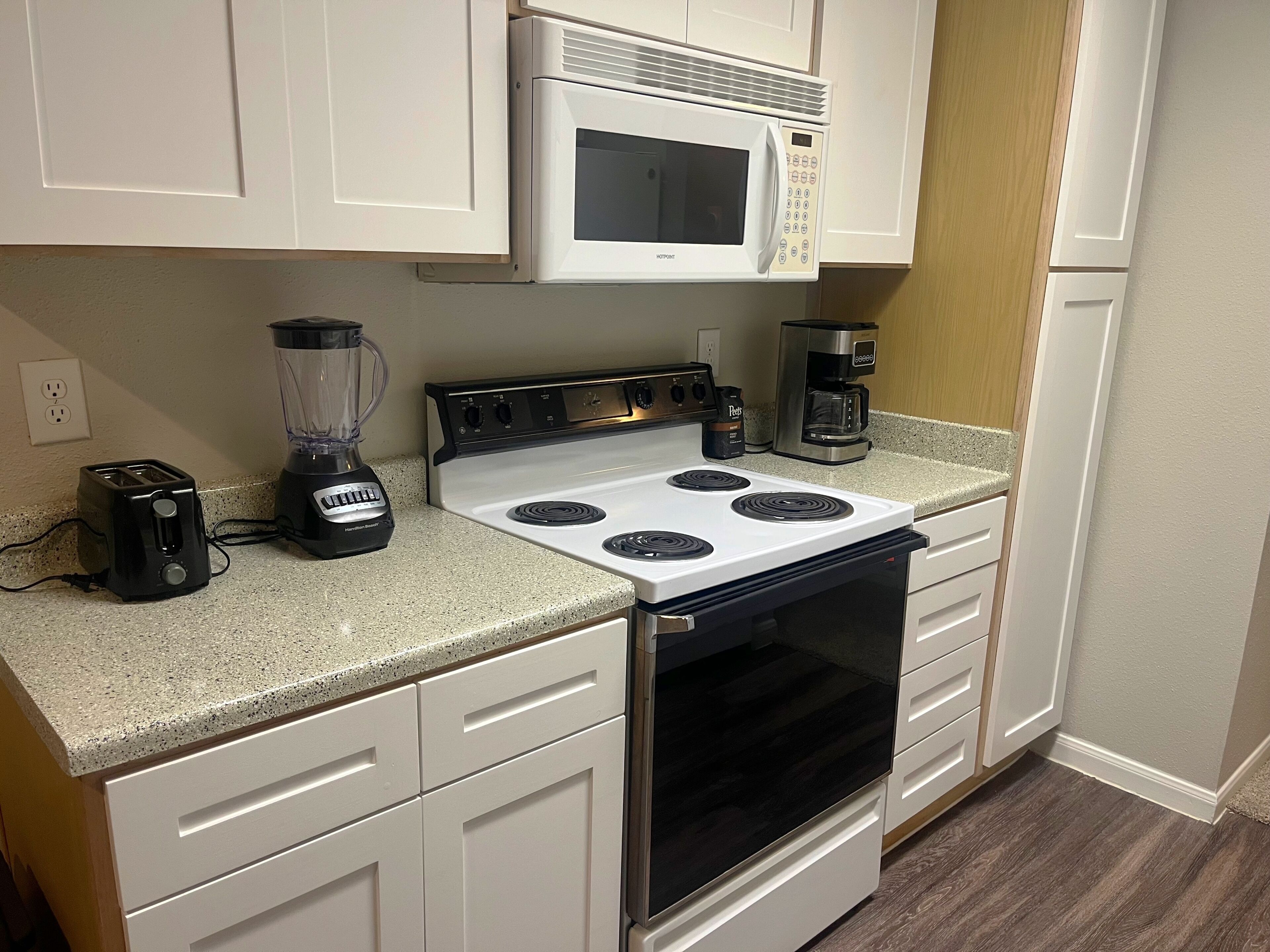Coffee/tea maker, fridge, microwave, oven
