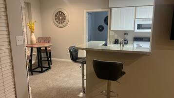 Coffee/tea maker, fridge, microwave, oven