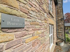 A stone wall with a sign reading 'Little Pentwyn.' - Little Pentwyn (Hereford)