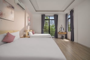 A hotel room with two beds, a window with curtains, a bedside table with a lamp, and a small plant. - Cam On Luxury Pool 4BR Villa by the Beach (An Hai)
