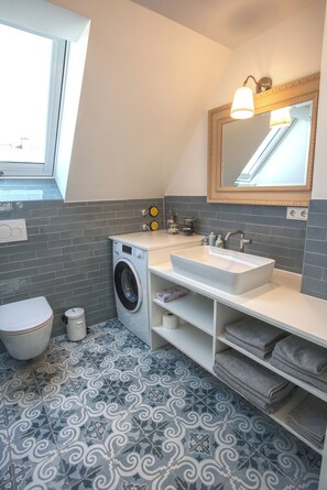 Shower, hair dryer, towels, soap