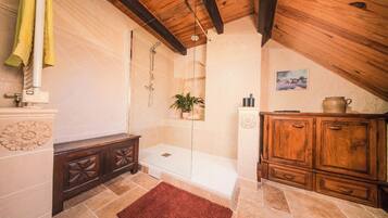 Shower, hair dryer, towels, toilet paper