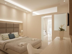 Ein modernes Hotelzimmer mit Bett, Nachttisch, Lampe und Blick auf das angrenzende Zimmer.
