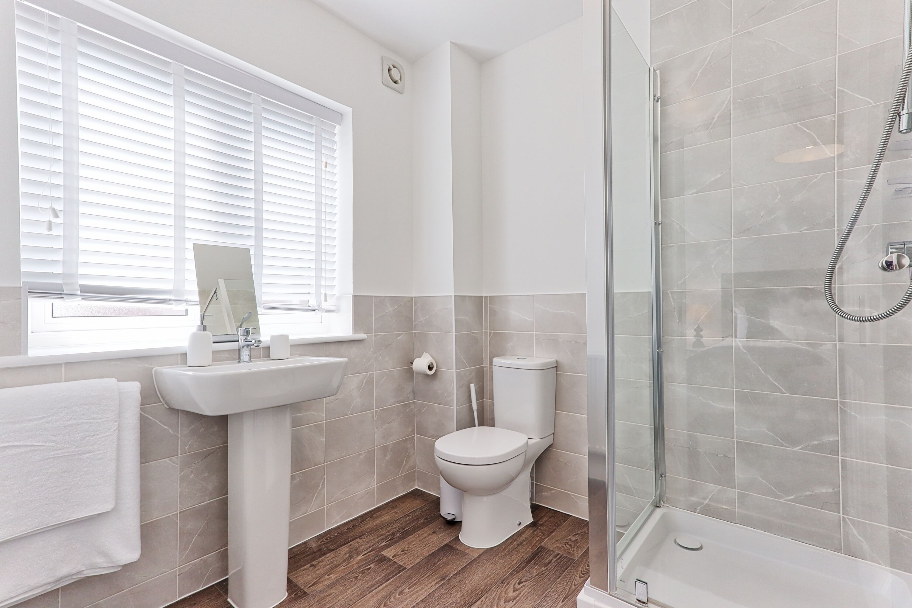 Shower, hair dryer, towels, toilet paper