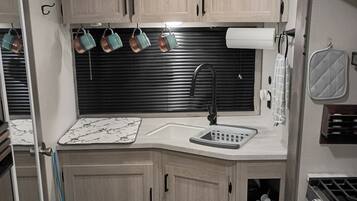 Fridge, microwave, coffee/tea maker, toaster
