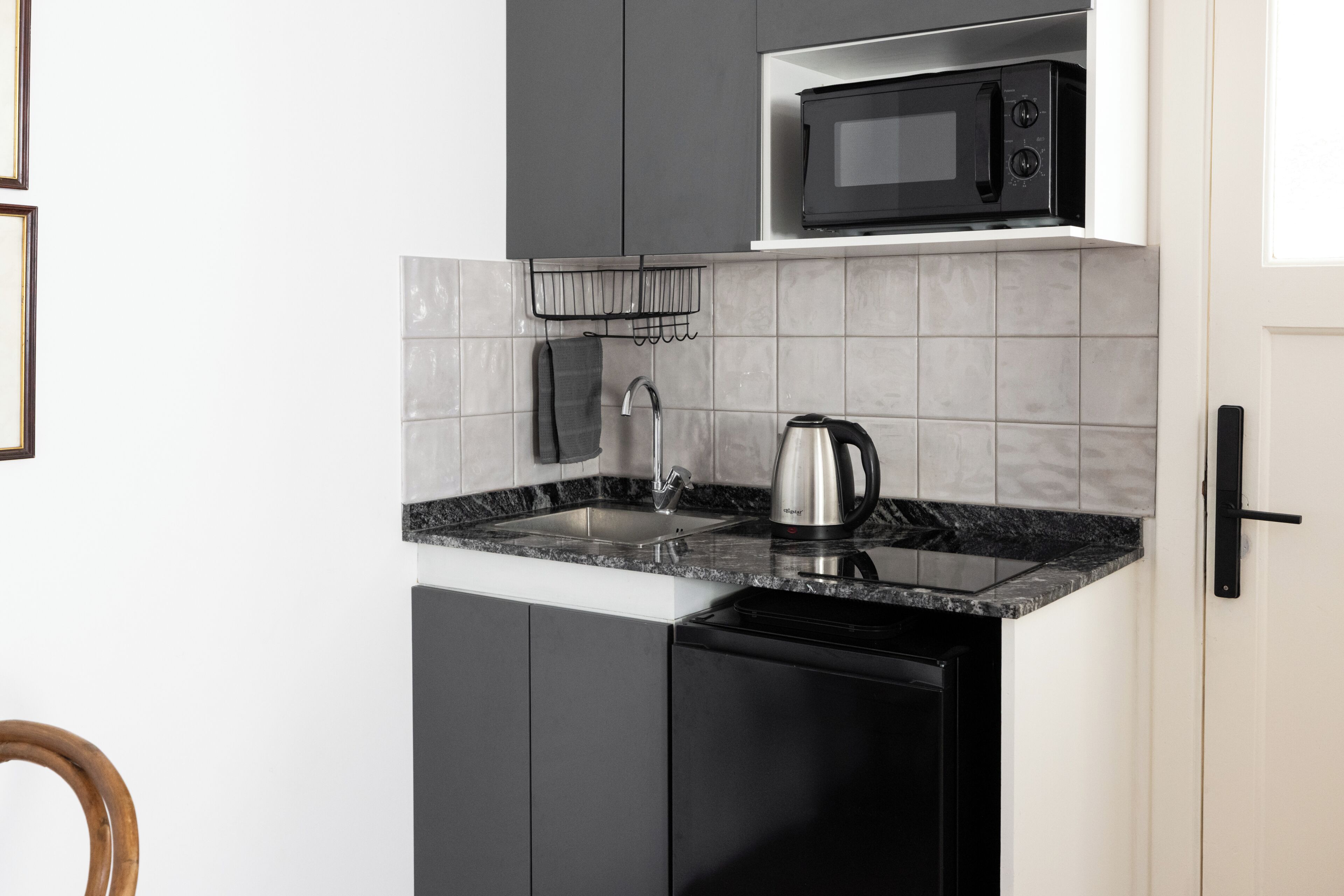 Deluxe Suite, Patio, City View | Private kitchen | Coffee/tea maker, mini-fridge, microwave, stovetop