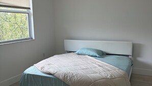A bedroom with a bed, a window, and a view of trees. - 3BR house+loft near Wynwood, perfec getaway! (Miami)