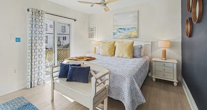 WatersView Inn - Steps to the beach and downtown South Haven. Enjoy this 3- room (King, Queen & Bunk room) with oversized bathroom with shower, tub and two vanities. Living room, kitchenette & private deck looking at the harbor.
