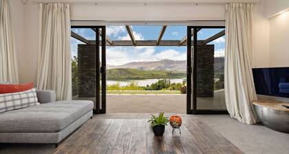 Lake Hayes retreat offers breathtaking mountain and lake views with modern luxury amenities.