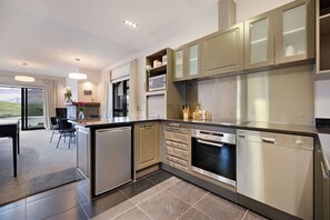 Fridge, microwave, stovetop, dishwasher - Lake Hayes retreat offers breathtaking mountain and lake views with modern luxury amenities. (Lake Hayes)