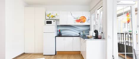 Microwave, stovetop, coffee/tea maker, toaster