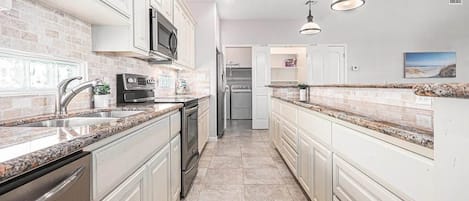 Coffee/tea maker, fridge, microwave, oven