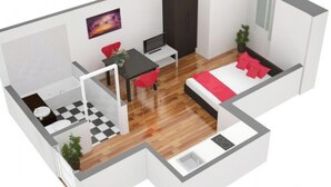 En 3D-ritning av planlösningen för en modern lägenhet med separat badrum, matplats, sovrum med säng och röda kuddar samt ett litet köksområde.