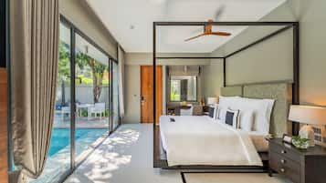 A modern hotel room with a large bed, a ceiling fan, a desk, and a view of a swimming pool.