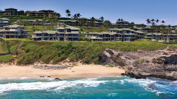 A coastal resort with beachfront villas, a rocky shoreline, and palm trees. - The Kapalua Villas Maui by Outrigger (KAPALUA)