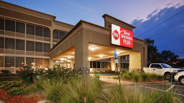 A hotel with a sign reading 'BW Best Western PLUS.' - Best Western Plus Lower South End (Charlotte)