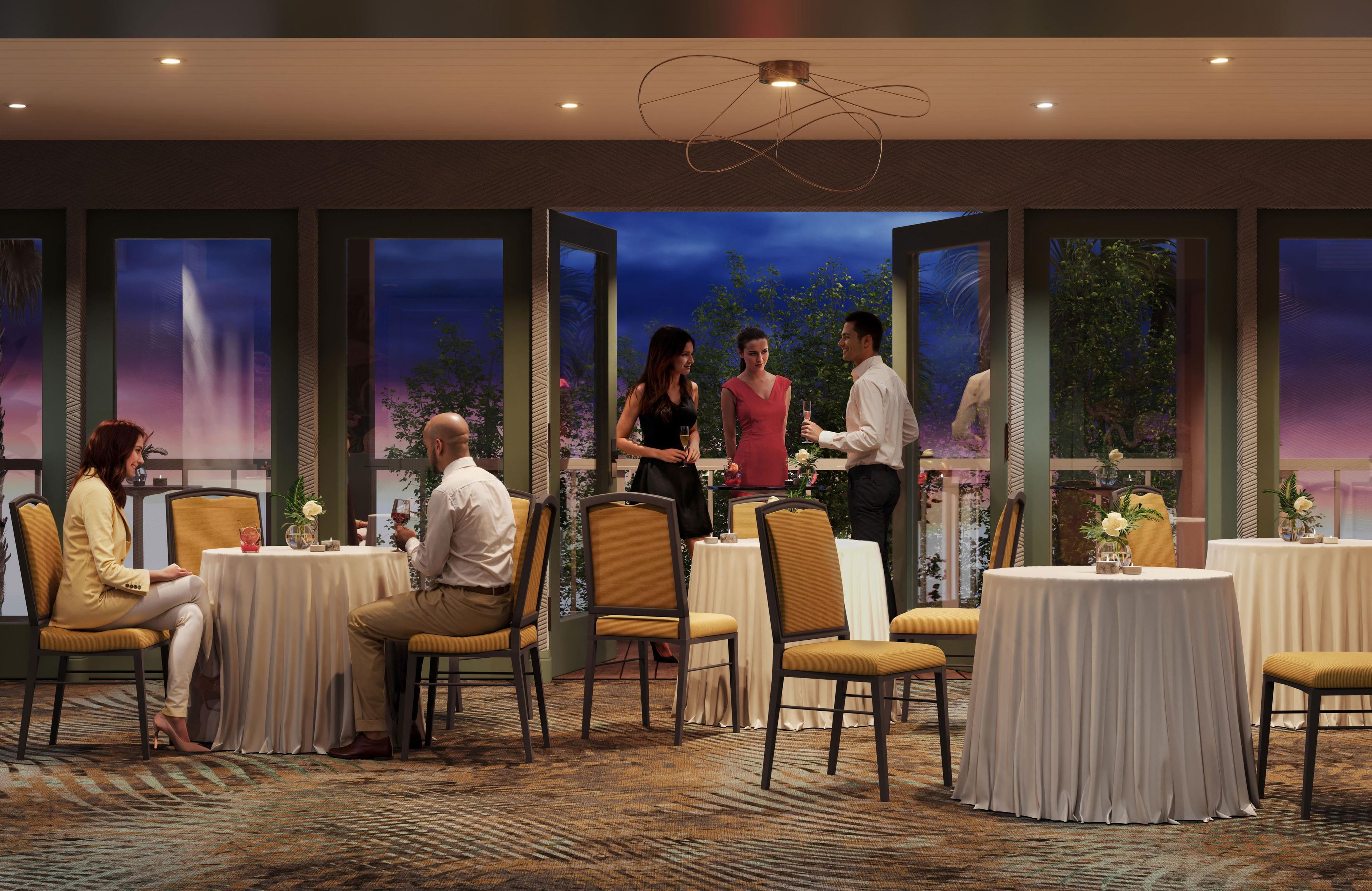 Un restaurante con varias mesas y sillas, una zona de bar y amplios ventanales con vistas a árboles y al cielo nocturno.