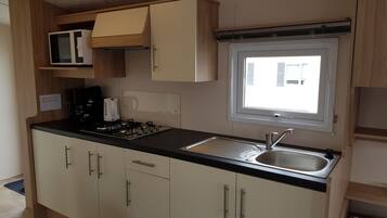 Fridge, microwave, cookware/dishes/utensils