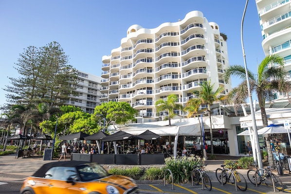 A modern building with multiple balconies and a covered outdoor seating area. - Mantra Zanzibar Mooloolaba (Sunshine Coast)