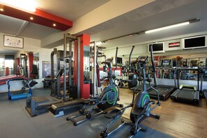 A gym with treadmills, elliptical machines, and weightlifting equipment. - Pontikonissi Adults Only (Corfu)