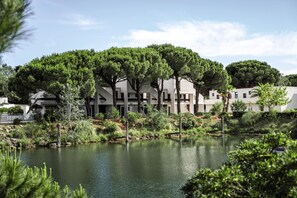 A modern building with a water feature in front. - La Grande Motte "Le Ponant" (La Grande-Motte)