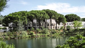 A modern building with a water feature in front. - La Grande Motte "Le Ponant" (La Grande-Motte)