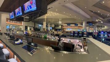 A modern bar area with multiple gaming machines, a Cantina, and a Homestyle restaurant.