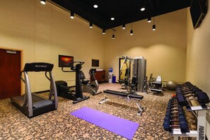 A gym with treadmills, weight machines, and dumbbells. - Caesars Southern Indiana Hotel Casino (Elizabeth)