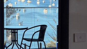 A balcony with a view of a marina with sailboats. - KozyGuru | Manly | Prime Manly Coastal Hub (Manly)