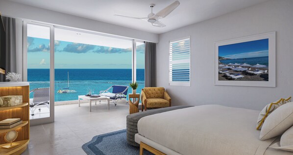 A hotel room with a large bed, a desk, a chair, a small table with a plant, and a view of the ocean.