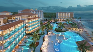 Un resort con varias piscinas, palmeras y vistas a la playa.
