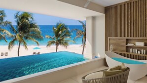 A modern bathroom with a bathtub, a wicker chair, and a view of a beach with palm trees.