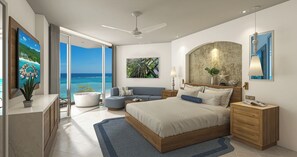 A modern bedroom with a large bed, a sofa, a desk, and a view of the ocean. - Sandals Dunn's River Falls (Ocho Rios)
