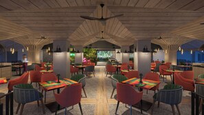 A restaurant with wooden ceiling beams, colorful chairs, and tables. - Sandals Dunn's River Falls (Ocho Rios)