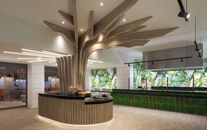 A modern reception area with a unique wooden centerpiece, a counter with amenities, and a green wall with plant wallpaper. - Sandals Dunn's River Falls (Ocho Rios)