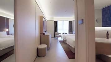 Premium bedding, down comforters, memory foam beds, free minibar