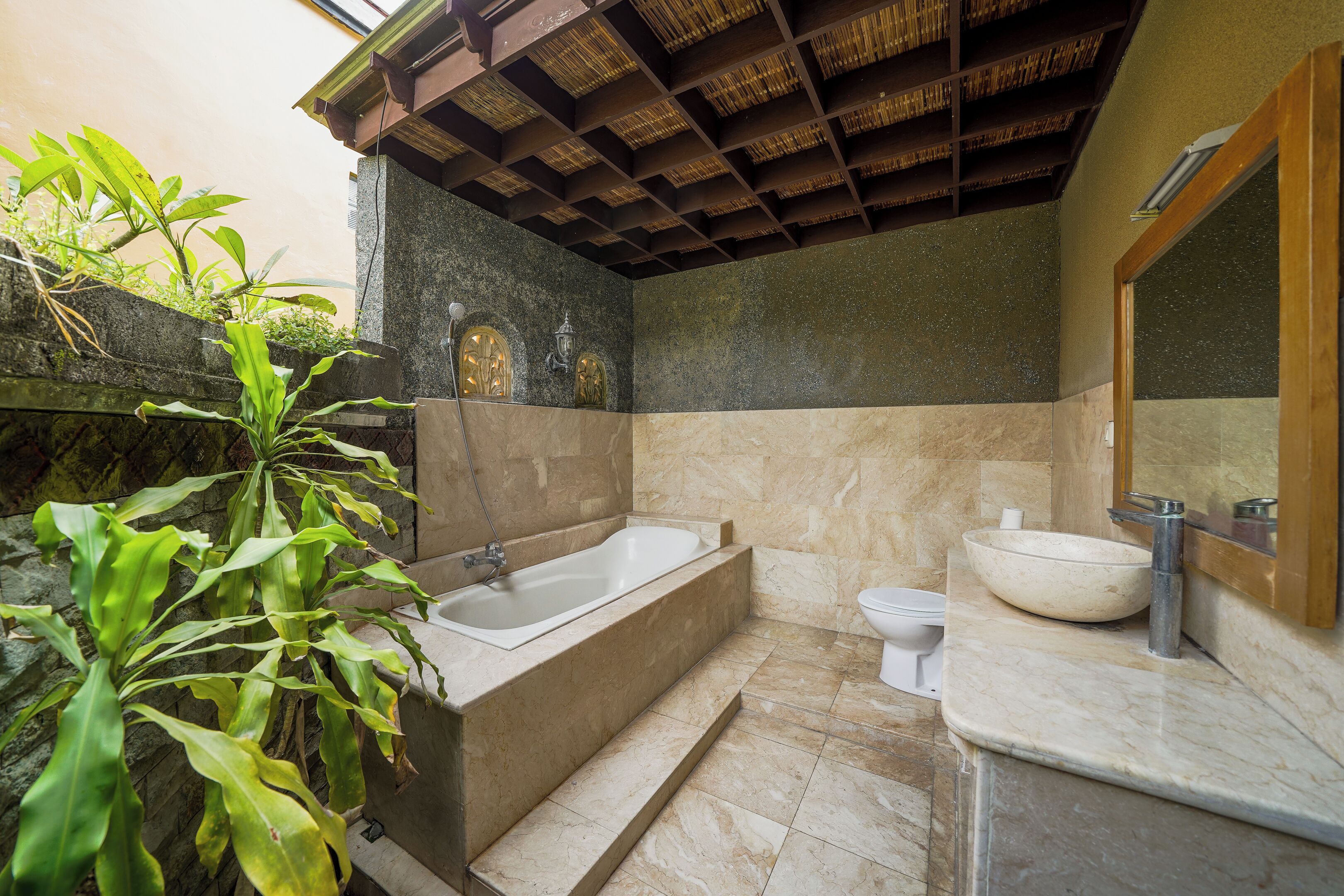 A bathroom with a bathtub, a sink, and a toilet.