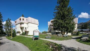 A modern building with a sign indicating it is a village accommodation.