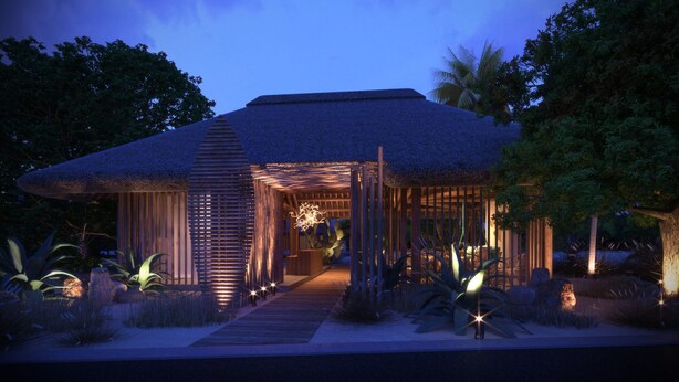 A modern building with a thatched roof, a wooden entrance, and a pathway leading to the door. - Veranda Tamarin Hotel & Spa (Tamarin)