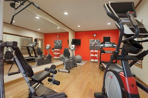 A gym with cardio machines, weight equipment, and mirrors. - Country Inn & Suites by Radisson, Pineville, LA (Pineville)