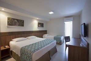 A hotel room with a large bed, a smaller bed, a desk, and a TV. - Rio Quente Resorts Refugio Grand Premium (Rio Quente)