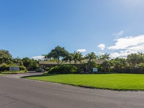 A resort with a paved road, a grassy area, and a building with a tiled roof. - Quality Hotel Ballina (Ballina)