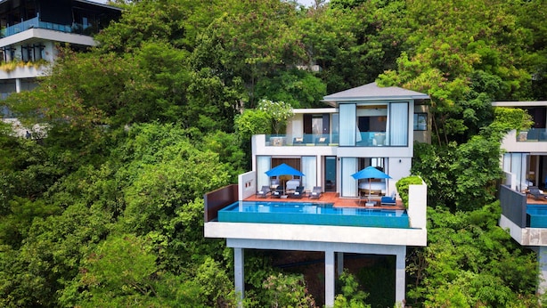 A modern two-story building with a rooftop pool, surrounded by dense greenery. - Conrad Koh Samui Resid (Koh Samui)
