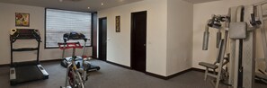 A gym with treadmills, stationary bikes, and weight machines. - Airport Hotel Grand (New Delhi)