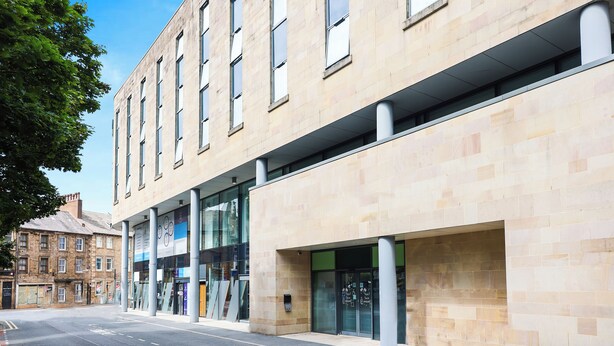 A modern building with large windows and a clean facade. - Ibis Budget Lancaster Centre (Lancaster)