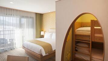 A hotel room with a large bed, a wooden bunk bed, a desk, and a chair.