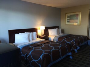 A hotel room with two beds, a nightstand with a lamp, a telephone, and a framed picture on the wall. - Residential Suites Blue Springs by Hotel O I 70 (Grain Valley)